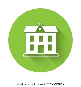 White School building icon isolated with long shadow. Green circle button. Vector