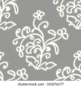 White seamless lace pattern on a gray background. Vector illustration