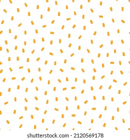 White seamless pattern with yellow sprinkles background.