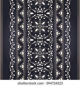 White seamless vintage border on dark gray background. Ornate element for design. Ornamental lace pattern for invitations and greeting cards. Traditional floral decor.