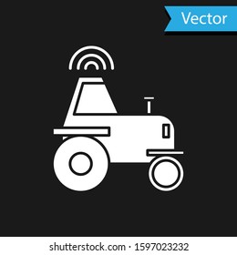 White Self driving wireless tractor on a smart farm icon isolated on black background. Smart agriculture implement element.  Vector Illustration