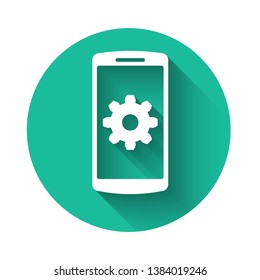 White Setting on smartphone screen icon with long shadow. Mobile phone and gear sign. Adjusting app, set options, repair, fixing phone concepts. Green circle button. Vector Illustration