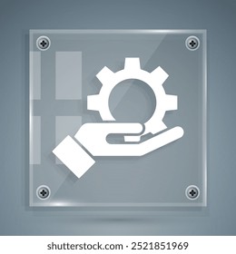 White Settings in the hand icon isolated on grey background. Square glass panels. Vector Illustration - Powered by Shutterstock - Get 15% off with code: PIKWIZARD15