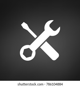 White settings tools icon on black background with shadow