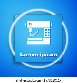 White Sewing machine icon isolated on blue background. Blue square button. Vector Illustration