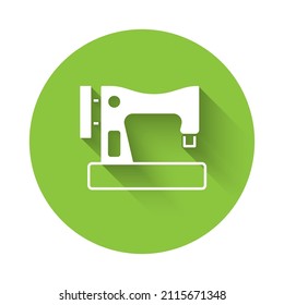 White Sewing machine icon isolated with long shadow. Green circle button. Vector
