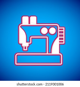 White Sewing machine icon isolated on blue background.  Vector