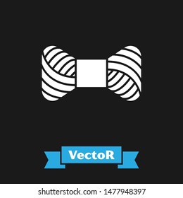 White Sewing thread on spool icon isolated on black background. Yarn spool. Thread bobbin.  Vector Illustration