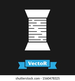 White Sewing thread on spool icon isolated on black background. Yarn spool. Thread bobbin.  Vector Illustration