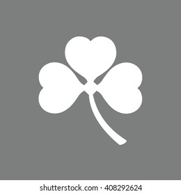 White shamrock icon vector illustration. Gray background