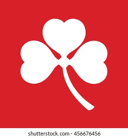 White shamrock icon vector. Red background