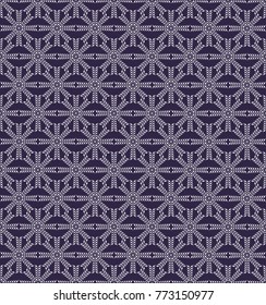 the white shapes (snowflakes) form a seamless pattern on an ultra-violet background