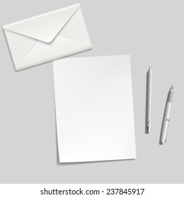 white sheet, envelope, pen and pencil on the table