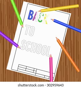 White sheet of paper with colorful pencils. Drawing of dashed text "Back to school". Wooden desk background