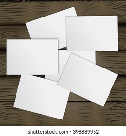 white sheets on wooden background,