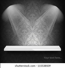 White shelf on wall with damask pattern