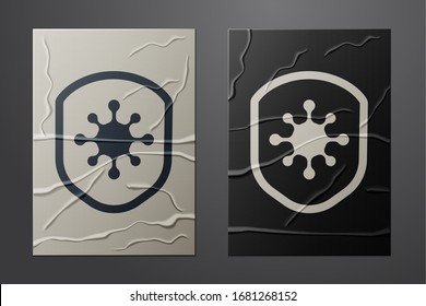 White Shield protecting from virus, germs and bacteria icon isolated on crumpled paper background. Immune system concept. Corona virus 2019-nCoV. Paper art style. Vector Illustration
