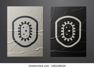 White Shield protecting from virus, germs and bacteria icon isolated on crumpled paper background. Immune system concept. Corona virus 2019-nCoV. Paper art style. Vector Illustration