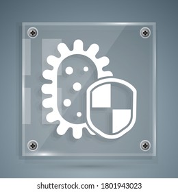 White Shield protecting from virus, germs and bacteria icon isolated on grey background. Immune system concept. Corona virus 2019-nCoV. Square glass panels. Vector Illustration