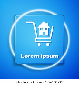 White Shopping cart with house icon isolated on blue background. Buy house concept. Home loan concept, rent, buying a property. Blue square button. Vector Illustration