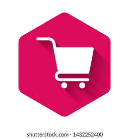 White Shopping cart icon isolated with long shadow. Online buying concept. Delivery service sign. Supermarket basket symbol. Pink hexagon button. Vector Illustration