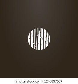 white sign on a black background. vector flat art negative space round sign of tree trunks  in the forest