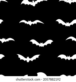 White silhouettes of bats seamless pattern  on black background.  Halloween design for baby clothes, bedding, textiles, print, wallpaper.