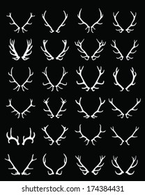 White silhouettes of deer horns on black background, vector