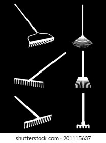 White silhouettes of rake on a black background, vector 