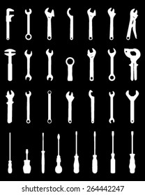 White silhouettes of  screwdrivers and screw wrench, vector illustration