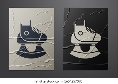 White Skates icon isolated on crumpled paper background. Ice skate shoes icon. Sport boots with blades. Paper art style. Vector Illustration