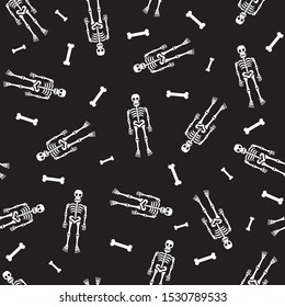 White skeletons and bones on black background seamless repeat pattern for helloween october holidays. Vector illustration.