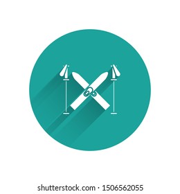 White Ski and sticks icon isolated with long shadow. Extreme sport. Skiing equipment. Winter sports icon. Green circle button. Vector Illustration