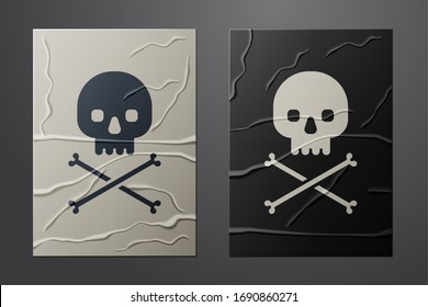 White Skull on crossbones icon isolated on crumpled paper background. Paper art style. Vector Illustration