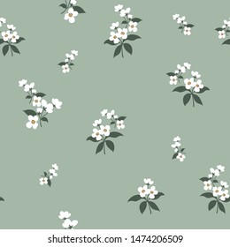 white small floral flowers pattern on green background