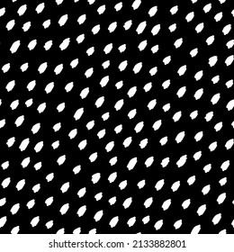 White small ink dots isolated on black background. Monochrome spotted seamless pattern. Dotted texture. Vector simple flat graphic hand drawn illustration.