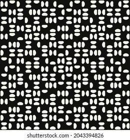 White small shapes and black background. Vector repeated shape.