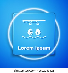 White Smart farm with light bulb and plant symbol icon isolated on blue background. Blue square button. Vector Illustration