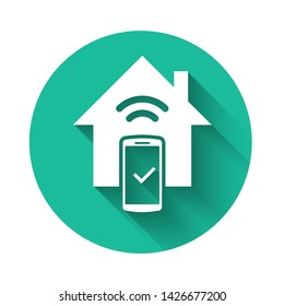 White Smart home - remote control system icon isolated with long shadow. Green circle button. Vector Illustration