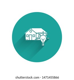 White Smart house and light bulb icon isolated with long shadow. Green circle button. Vector Illustration