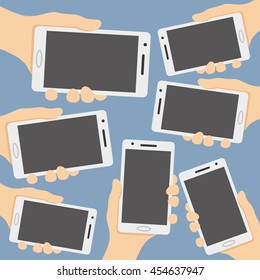 White smart phone in the hands.