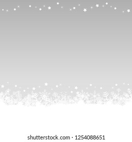 white snow flakes on bottom side and silver colored christmas background