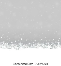 white snow flakes on bottom side and silver colored background