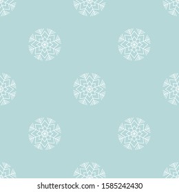 White snow flakes vector seamless pattern on blue background