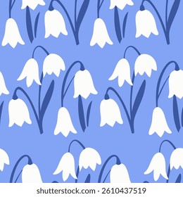 White snowdrop flowers on blue Seamless pattern background ideal for wrapping paper, fabric, textile etc.
