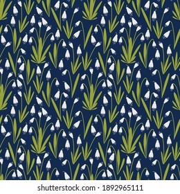 white snowdrops on blue background seamless pattern