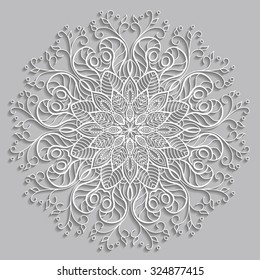 White snowflake circular ornament cut from paper