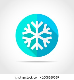 White snowflake in flat design with long shadow. Vector illustration. Simple snowflake icon on blue round button.