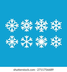 Iconos blancos del copo de nieve fijados en fondo azul