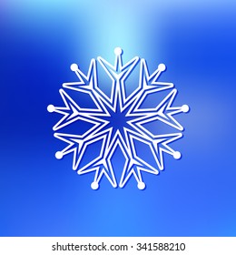 white snowflake on blue blurred abstract background